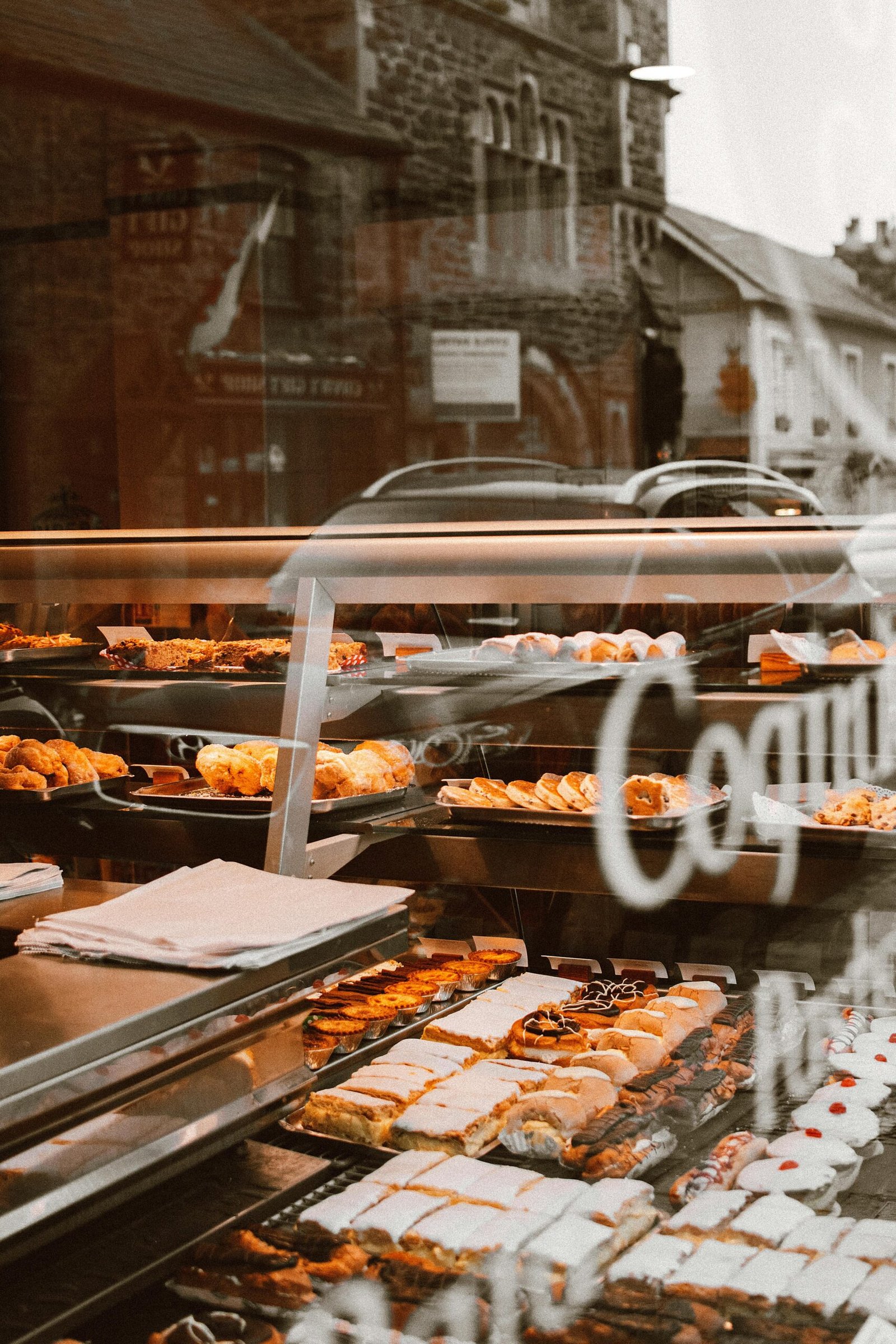 Delicious variety of pastries and bread in a warm, inviting bakery setting.